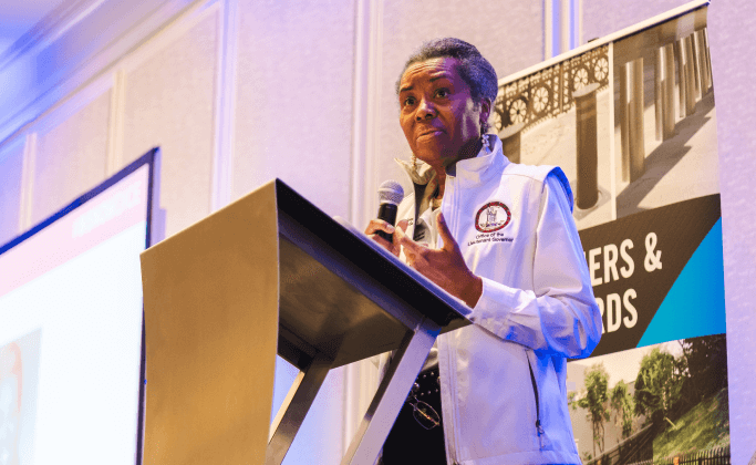 Woman with Microphone Speaking