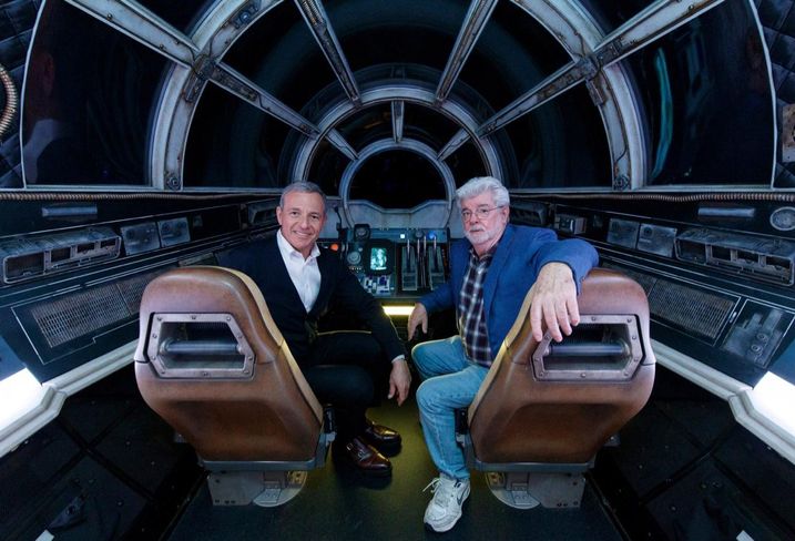 The Walt Disney Co. Chairman and CEO Bob Iger and Star Wars creator George Lucas pose inside Millennium Falcon: Smugglers Run at Star Wars: Galaxyâs Edge at Disneyland Park in Anaheim, California.