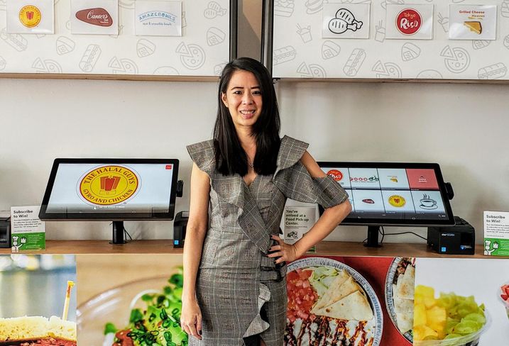 Kitchen United Director Dana Hathaitham poses inside Kitchen United's store in Pasadena